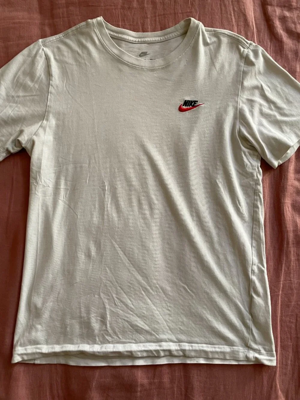 The Nike Tee With Two Red and Black Embroidered Logo - Size S